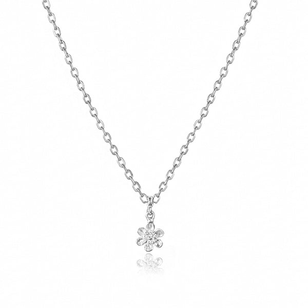 Silver necklace with a delicate flower pendant on a white background