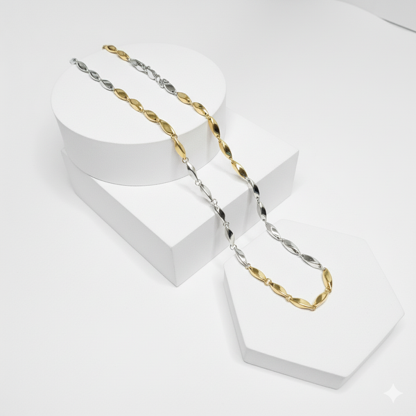 Two gold and silver chain necklaces on a white background