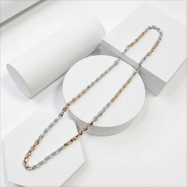 Two tone necklace chain, one silver and one rose gold, on a white stand with a white background.