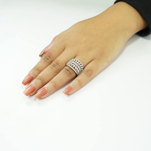 Elegant silver leaf pattern statement ring for women with crystal accents on white background
