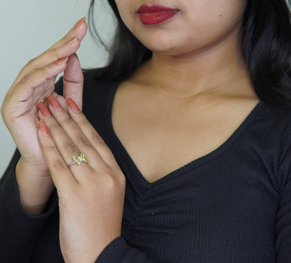 Silver-plated adjustable butterfly ring featuring marquise-cut green crystals, stylish handcrafted jewelry for women perfect for parties and gifting