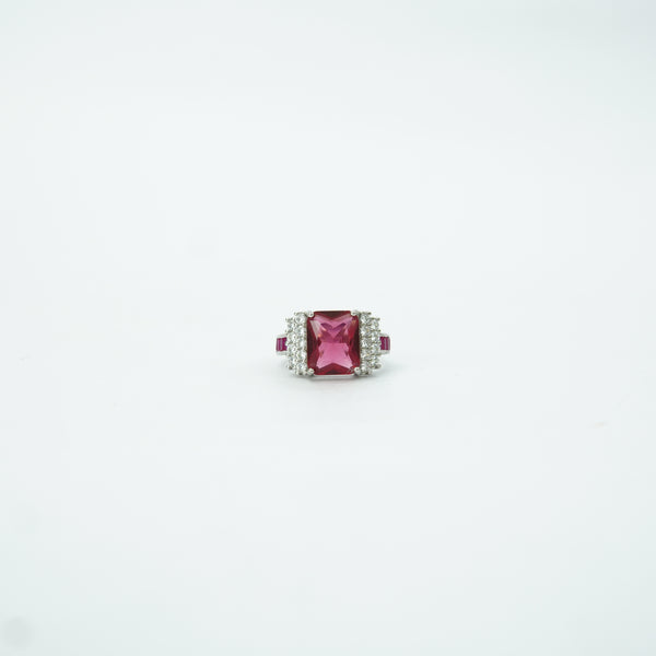 Jewelry with a pink gemstone on a white background