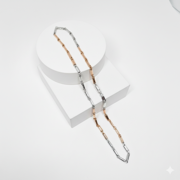 Two-tone silver necklace chain with different color schemes on a white background