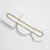 Two tone gold and silver chain necklaces on a white geometric stand.