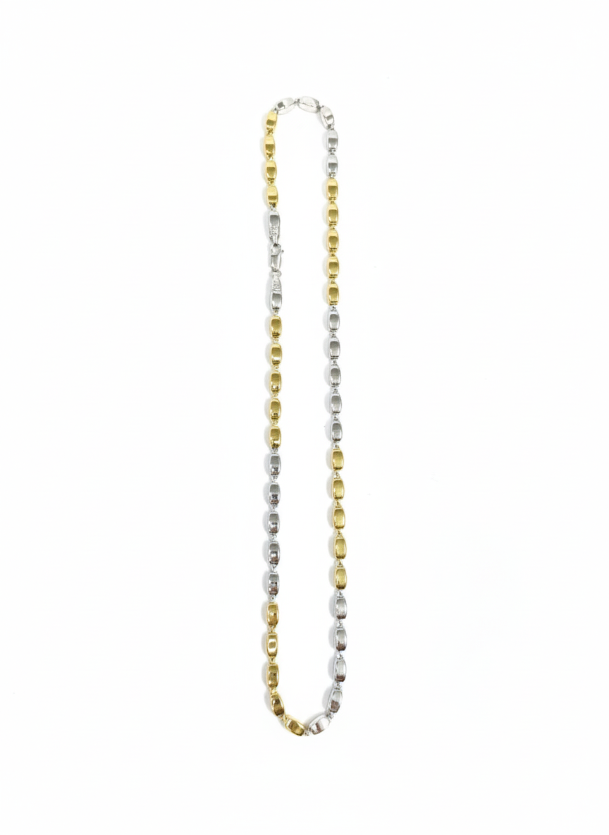 Two-tone gold and silver necklace on a white background