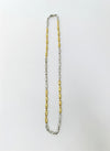Two-tone silver and gold chain necklace on a white background