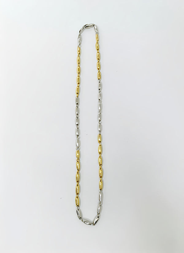 Two-tone silver and gold chain necklace on a white background