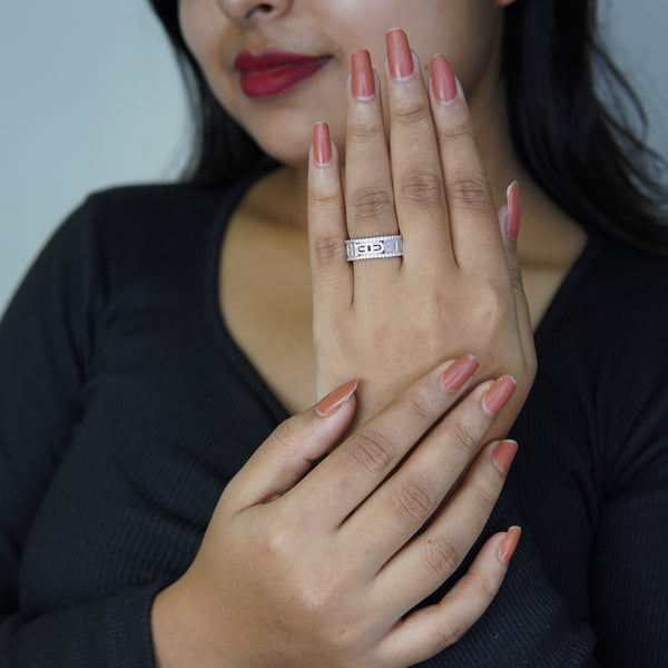 Luxury silver tone statement ring with geometric design on model hand