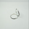 Two silver kids bangle with black beads on a white background