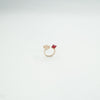 Luxury rose gold ring featuring red gemstone and floral design