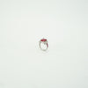 Ring with a pink gemstone on a white background