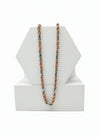 chain Necklace with rose gold and silver chain on a white geometric display stand