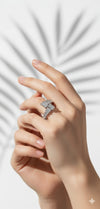 Hand wearing a diamond ring orsilver ring with gemstone on a white background